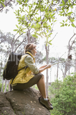 Smiling woman taking selfies