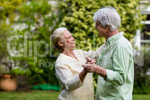 Couple dancing in yard