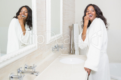 Young woman brushing her teeth