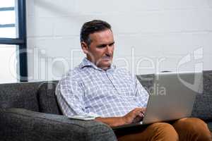 Man using laptop in office