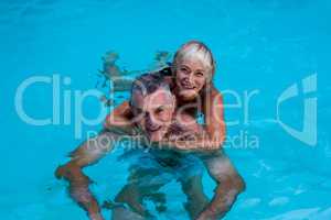 Senior couple enjoying in swimming pool