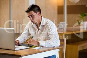 Man working on his graphics tablet