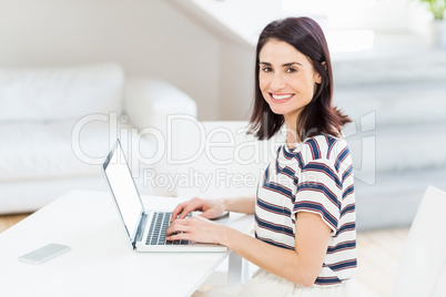 Young woman using laptop