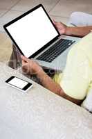 Senior man using laptop at home