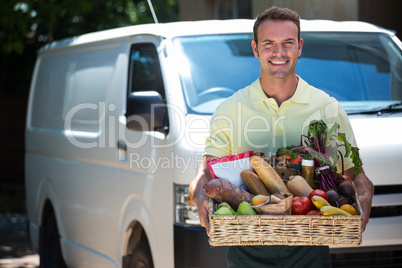 Happy man delivering groceries