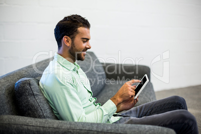 Young man using digital tablet