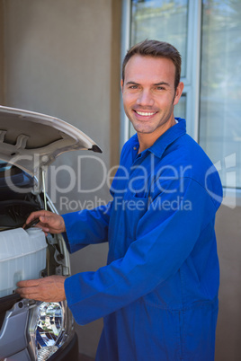 Mechanic examining the car