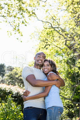 Couple embracing in the park