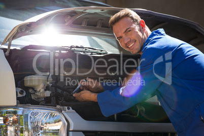 Mechanic examining the car