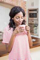 Young woman having coffee