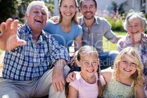 Multi-generation family sitting in the garden