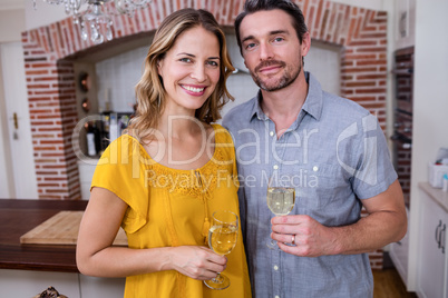 Portrait of a couple standing with a glass of wine Portrait of a couple standing with a glass of wine