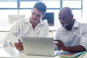 Colleagues working together at their desk