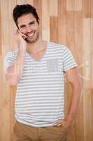 Smiling man talking on the phone