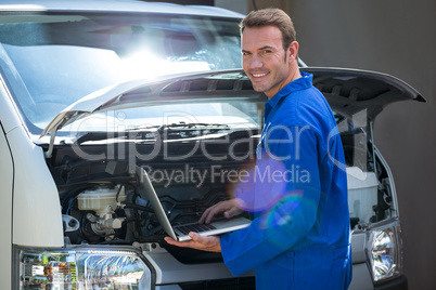 Mechanic using a laptop