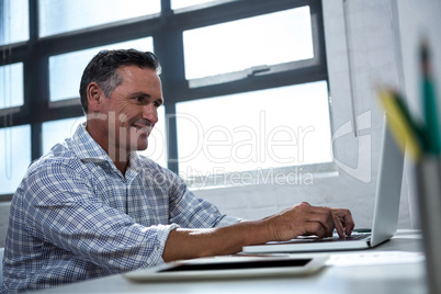 Man using laptop in office