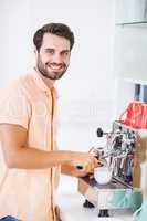 Man preparing coffee from coffeemaker