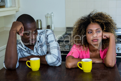 Upset couple ignoring each other after fight