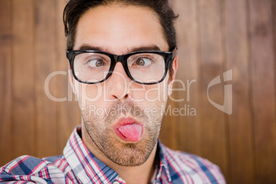 Young man pulling funny faces