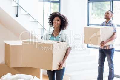 Young couple moving together in a new house