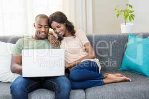 Young couple using a laptop