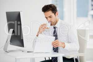 Businessman having a glass of water