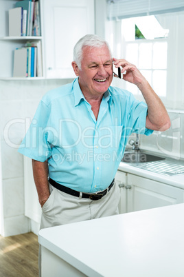 Smiling senior man talking on phone