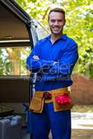 Mechanic with a tool belt around waist