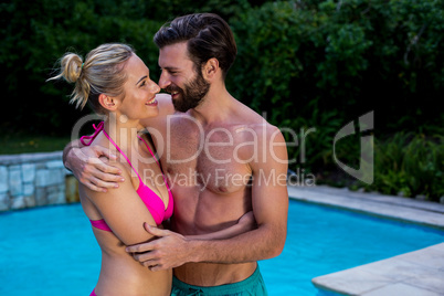 Couple in swimwear embracing each other