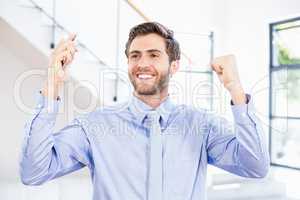 Excited businessman in office