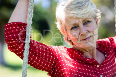 Close-up of a senior woman on swing