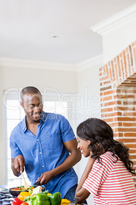 Young couple cooking food