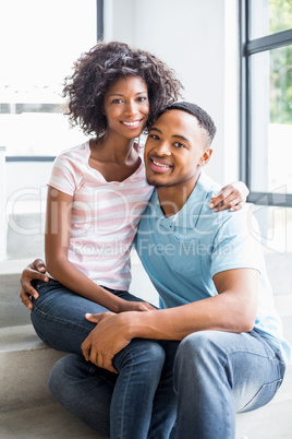 Young couple embracing on steps