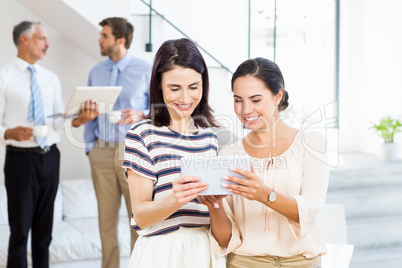 Businesswomen are looking at their notes