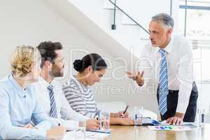 Business colleagues discussing in a meeting