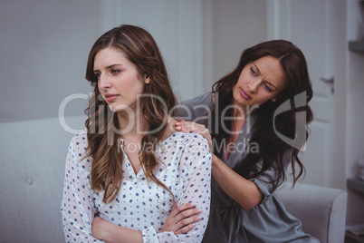 Woman comforting her upset friend