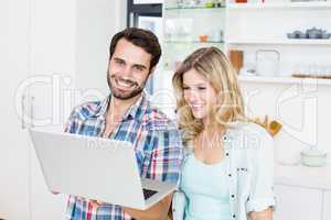 Young couple using laptop