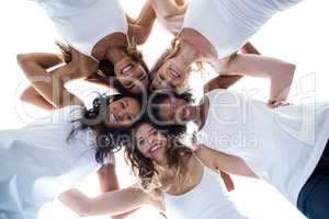 Happy women forming a huddle