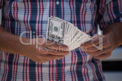 Man counting currency note