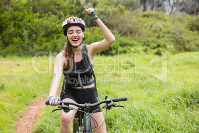 Smiling woman cycling