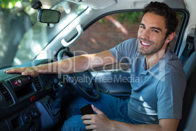 Smiling driver sitting in car