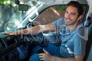 Smiling driver sitting in car