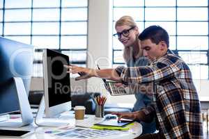 Graphic designer interacting at their desk