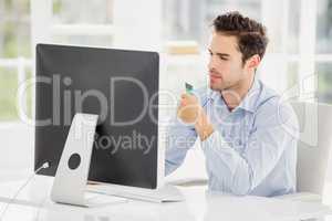 Businessman doing online shopping on computer