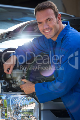 Mechanic examining the car