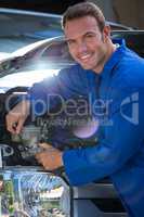 Mechanic examining the car