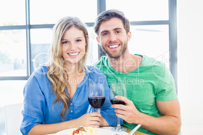 Young couple holding a wine glass