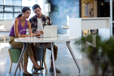 Colleagues working together at their desk