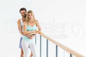Young couple standing near the railing