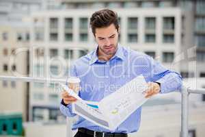 Businessman reading a newspaper